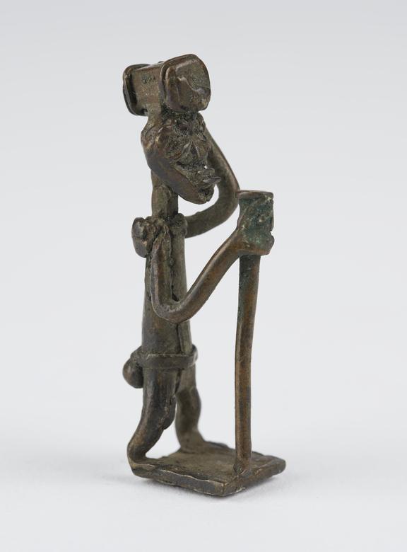 One of 84 Ashanti  brass weights in the form of a man with a