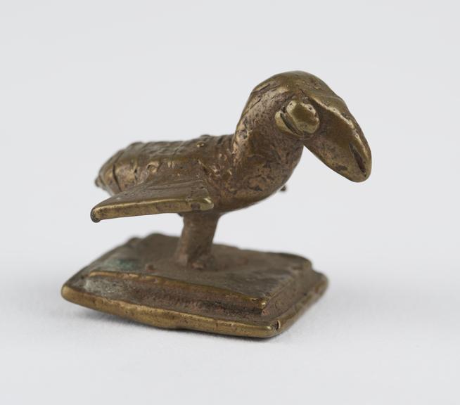 One of 84 Ashanti  brass weights in the form of a bird.