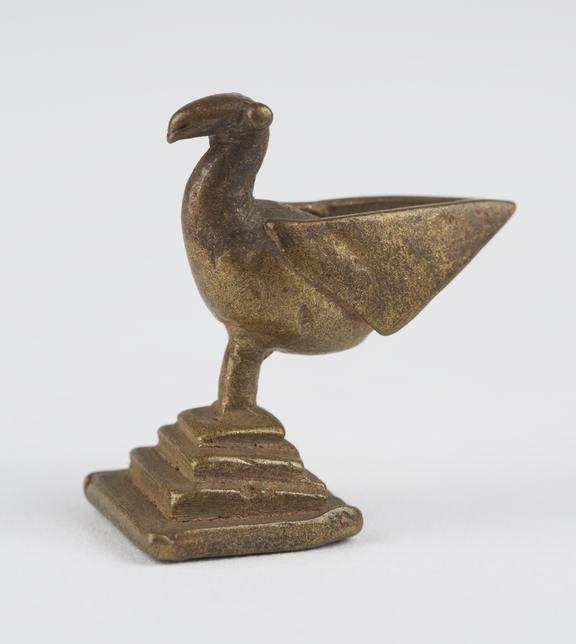 One of 84 Ashanti  brass weights in the form of a bird.