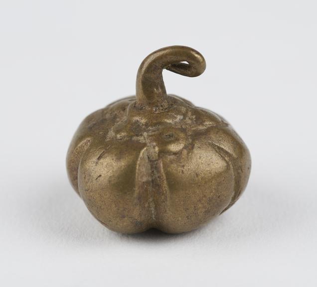 One of 84 Ashanti  brass weights in the form of a gourd.