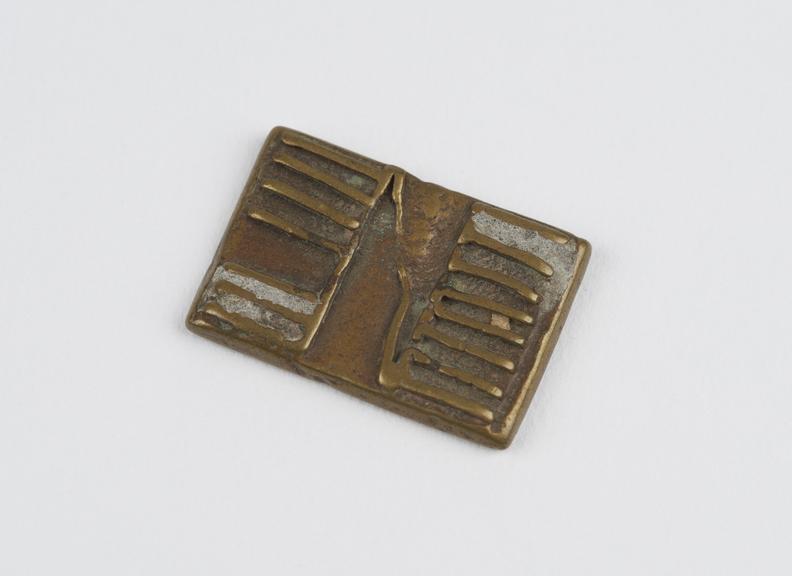 One of 84 Ashanti  brass weights in the form of a rectangular