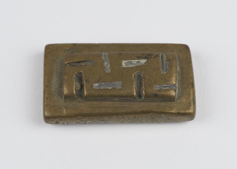 One of 84 Ashanti  brass weights in the form of a rectangular