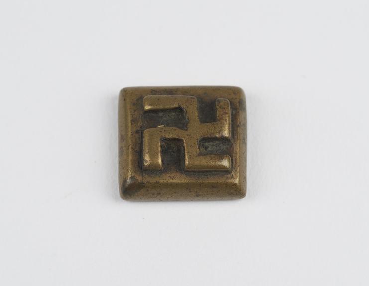 One of 84 Ashanti  brass weights in the form of a square tablet