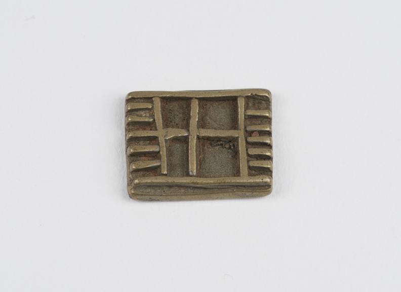 One of 84 Ashanti  brass weights in the form of a rectangular