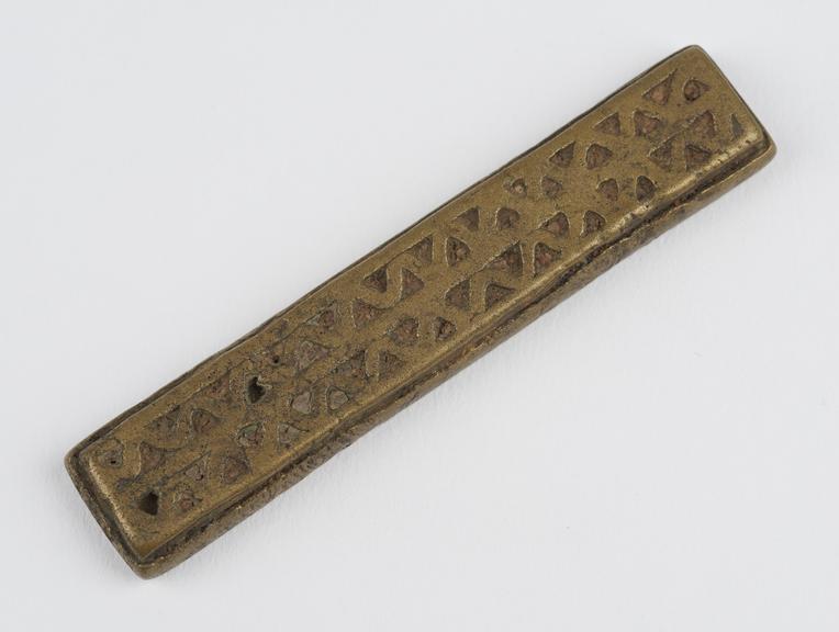 One of 84 Ashanti  brass weights in the form of a oblong bar