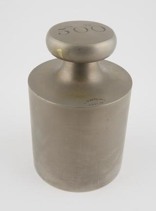 Cylindrical brass weight