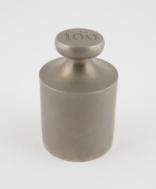 Cylindrical brass weight