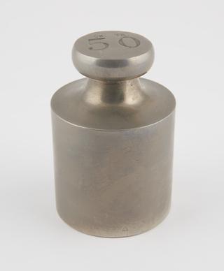 Cylindrical brass weight