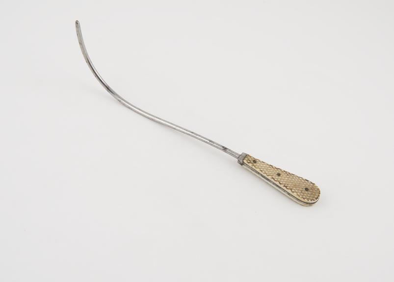 Small curved lithotomy staff with median curve and flat ivory