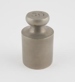 Cylindrical brass weight