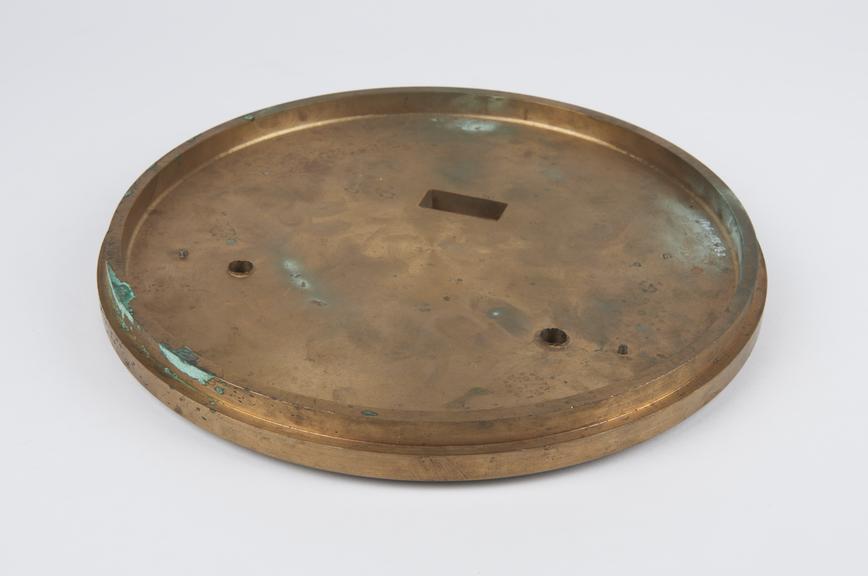 Circular brass cover plate from the example of the free