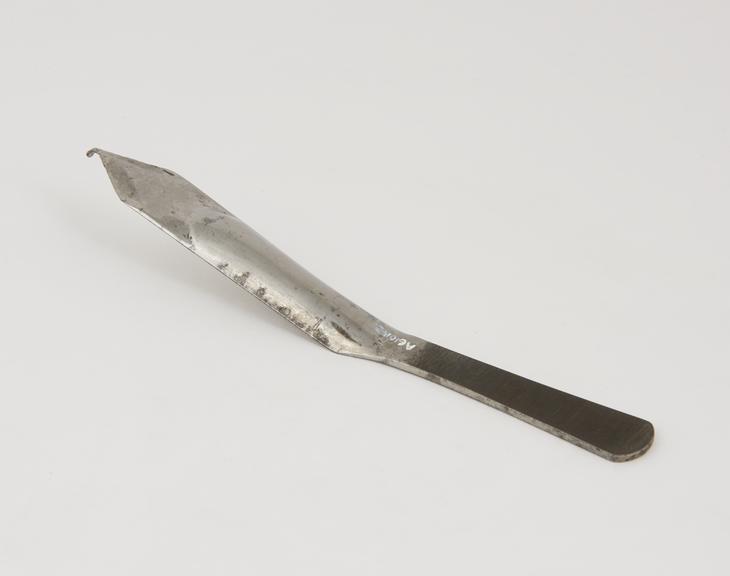 Lithotomy gorget with gutter shaped blade