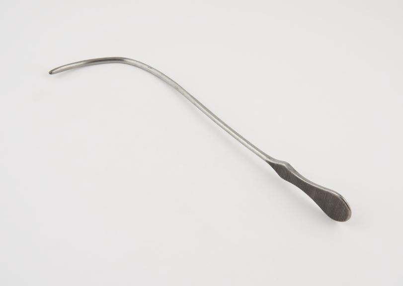 Large curved lithotomy staff with lateral groove and flat