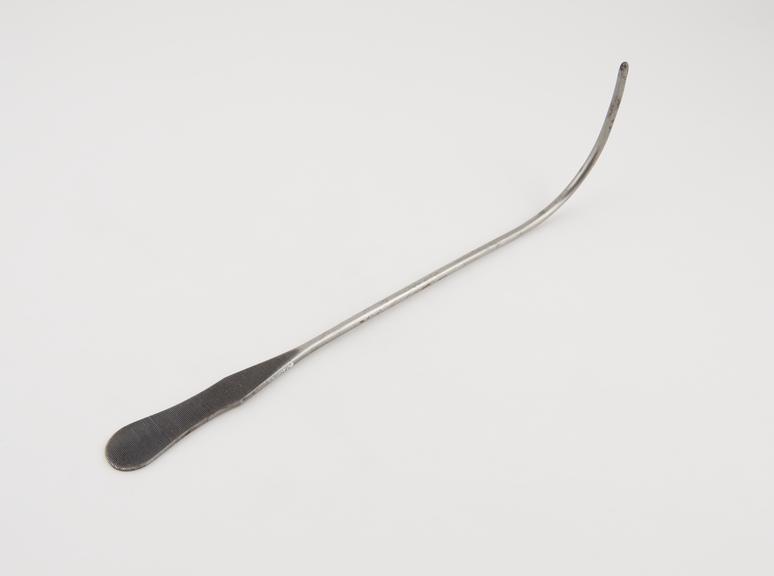 Curved lithotomy staff, with lateral groove, steel