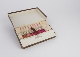 Box containing comparator tubes for comparing pH of phenol red