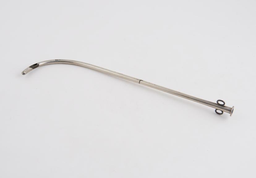 Silver catheter with proximal curve and removable distal sleeve