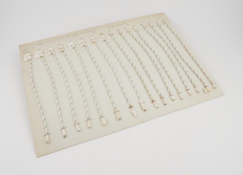 Sample card showing 16 samples of braid (white with black