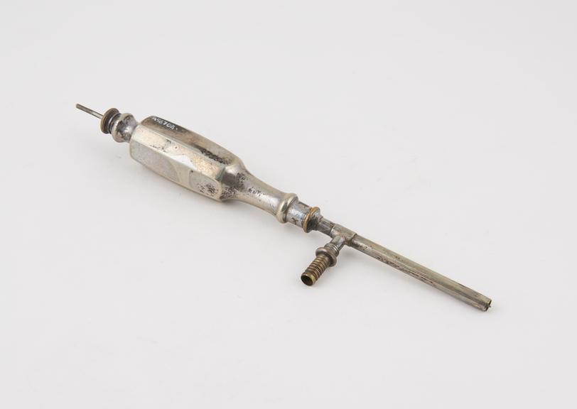 Thompson's trocar, steel with silver cannula and side branch