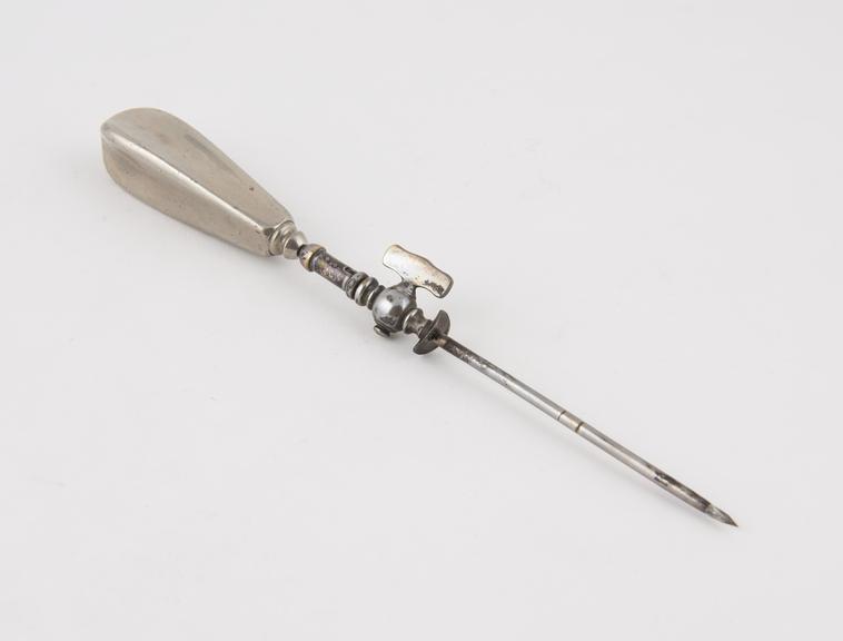 Steel trocar with silver(?) cannula and stopcock