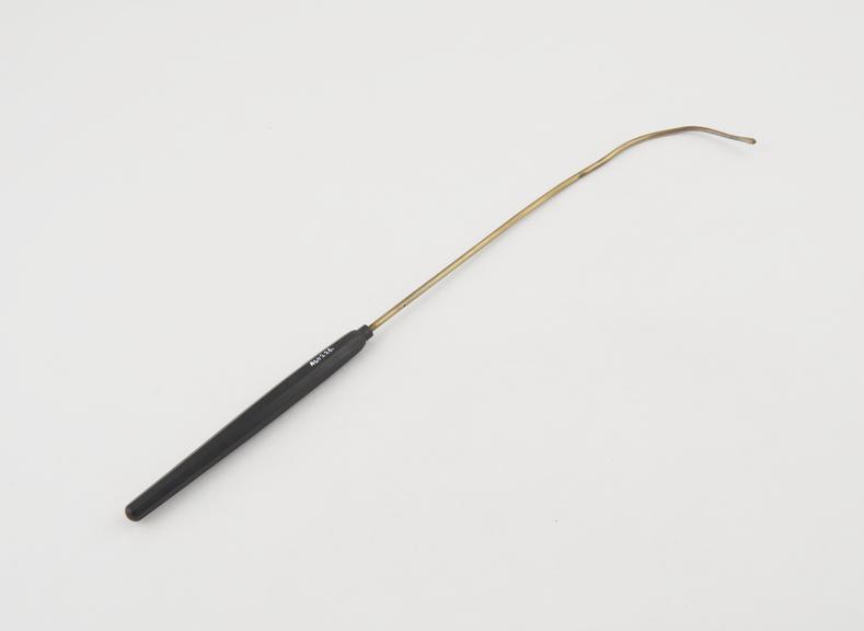 Urethral sound, with proximal curve, and wooden handle