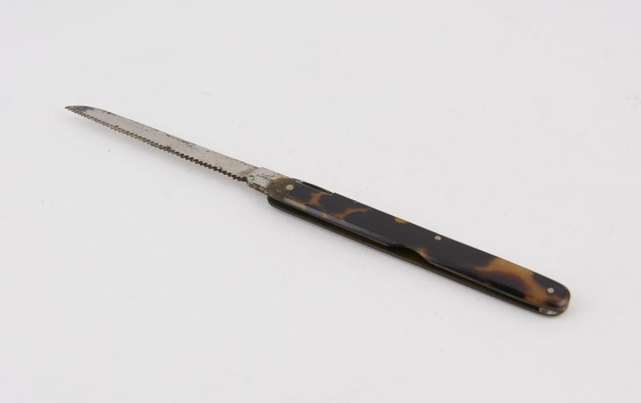 Finger saw, folding, steel, brass, and tortoiseshell, by Maw