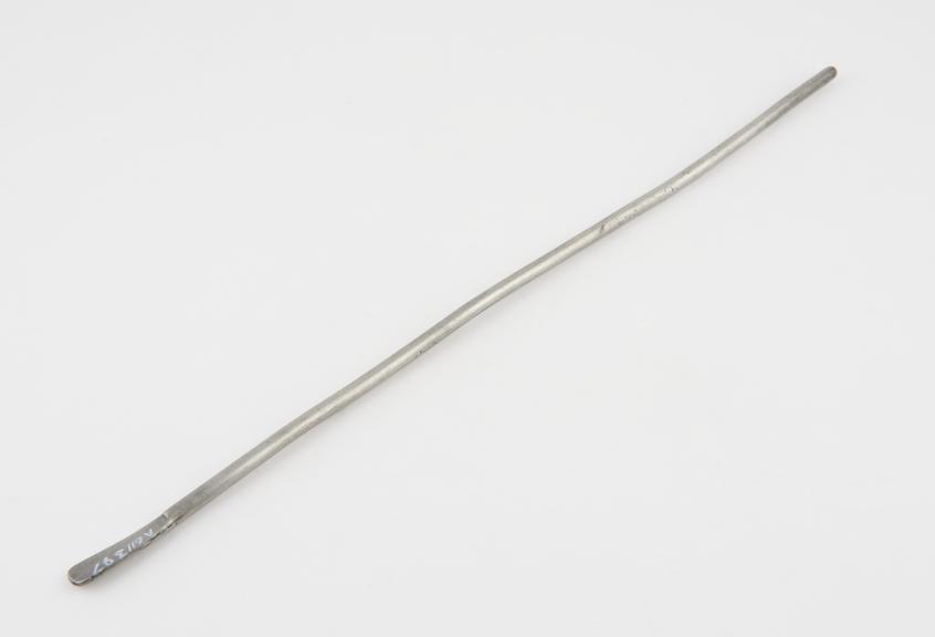 Straight cylindrical lead urethral sound, with flattened handle