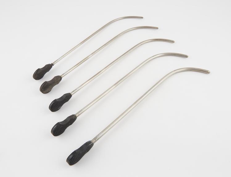 5 silver plated urethral sounds, with chequered ebony handles