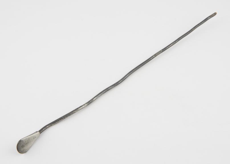 Straight, cylindrical urethral sound, with falttened handle