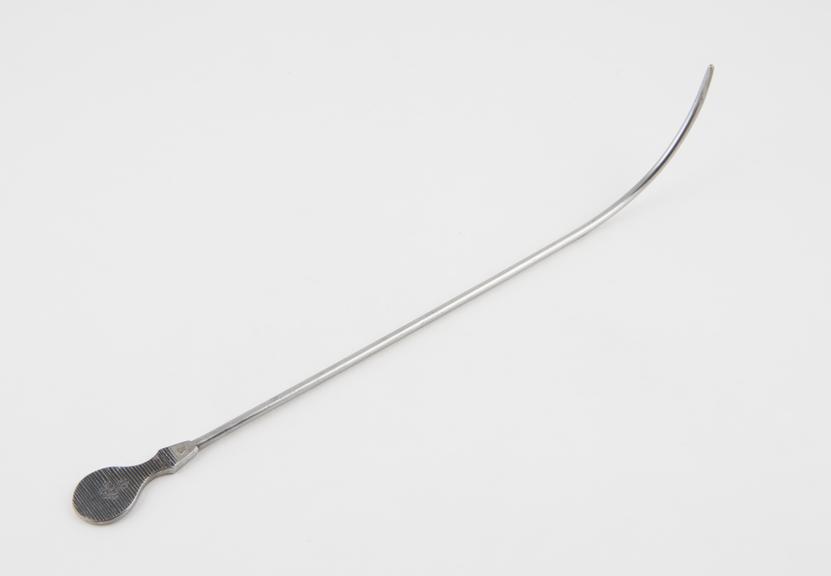 Urethral sound with tapered proximal curve and flat metal