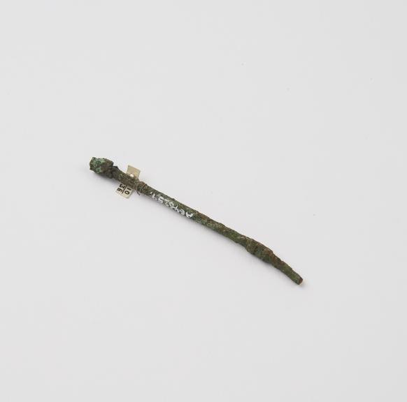 Small bronze cannula, possibly with trocar, encrusted