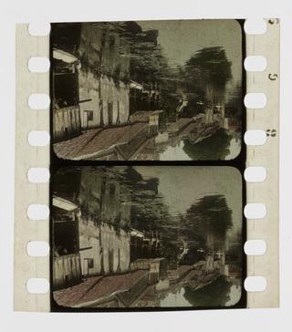 Two frames of silent 35mm stencil colour positive film