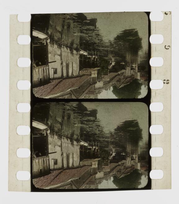 Two frames of silent 35mm stencil colour positive film showing