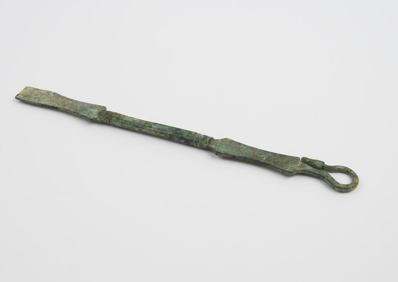 Double-ended spatula with looped serpents-head handle, bronze