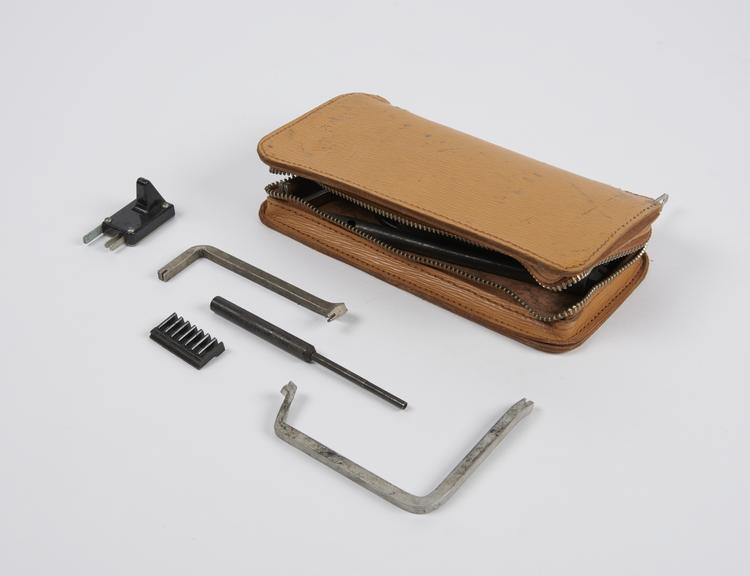 Zip fastened leather pouch, containing various engineer?s tools