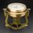 Self-registering compass on elaborate brass stand, clockwork mechanism records the ship's head every 3 minutes