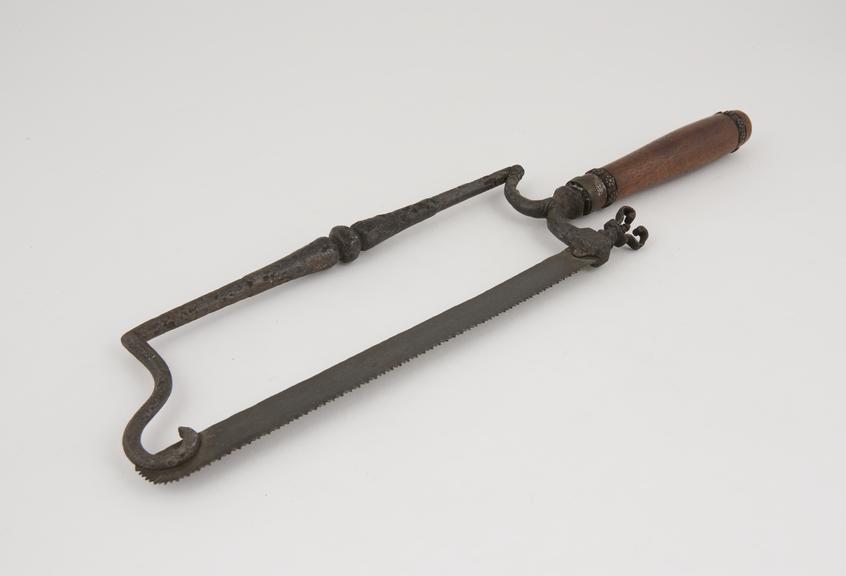 Ornate bow-frame amputation saw