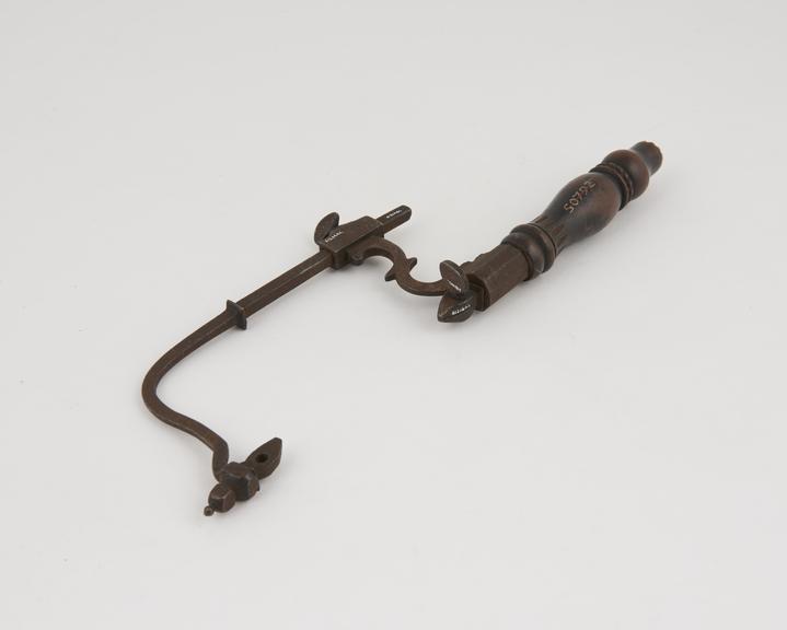 Small, ornate adjustable bow-frame amputation saw