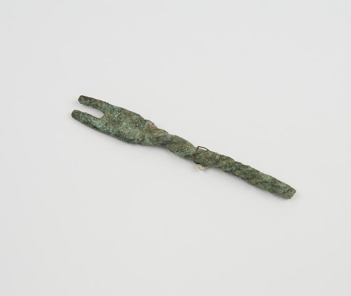 Two pronged fork with twisted stem, both prongs and stem broken