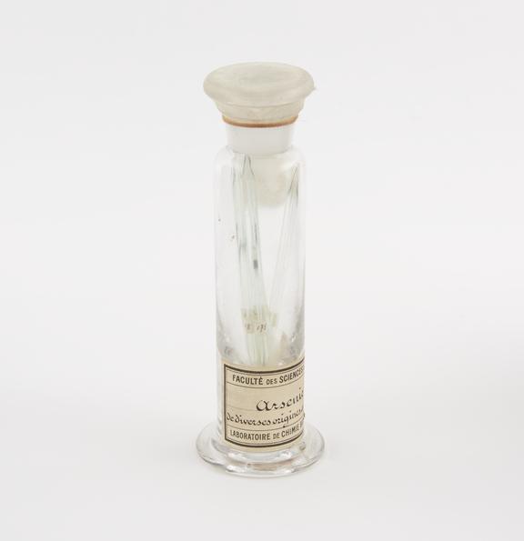 Glass specimen jar containing six sealed glass vials of Arsenic