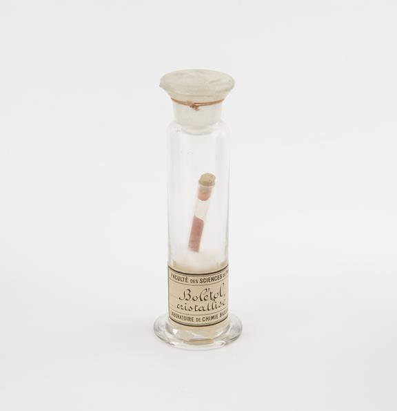 Glass specimen jar containing a test tube with cork stopper