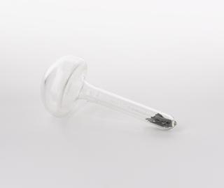 Mushroom shaped glass vial containing lutetium