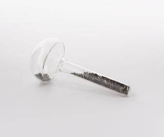 Mushroom shaped glass vial containing lanthanum