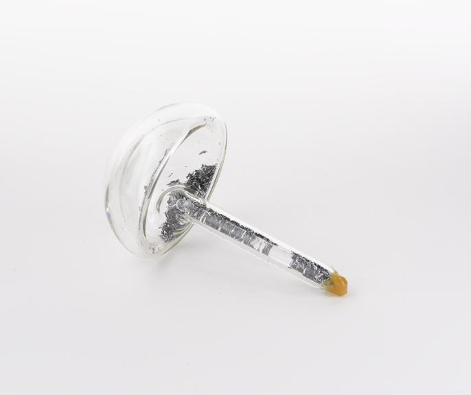 Mushroom shaped glass vial containing beryllium