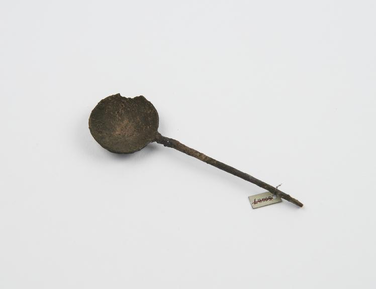 Bronze spoon, with circular bowl, repaired stem, from Syria