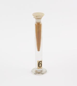 Glass jar containing auramine