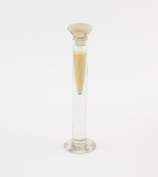 Glass jar containing benzil