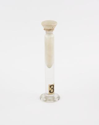 Glass jar containing benzophenone