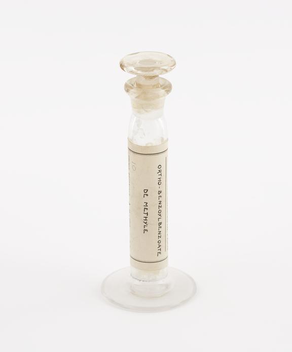 Glass specimen jar containing ortho-benzoylbenzoate de methyle