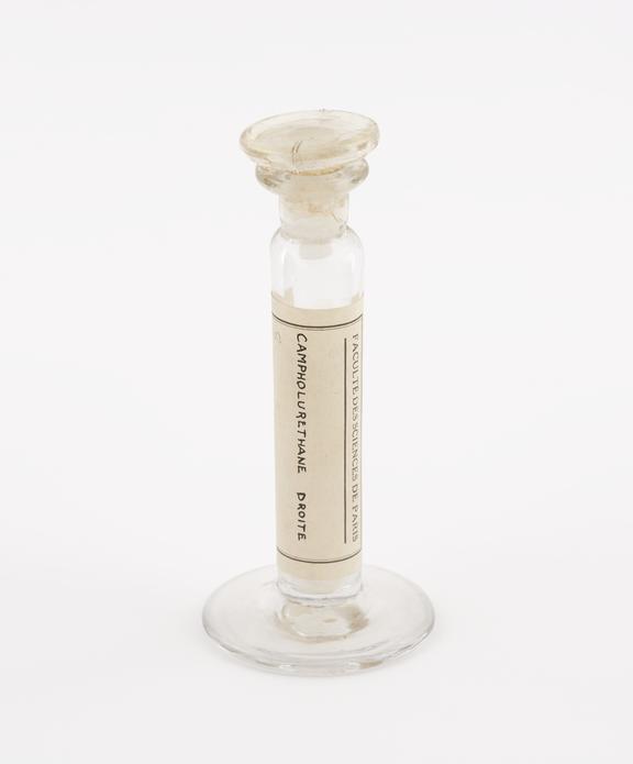 Glass specimen jar containing campholurethane droit