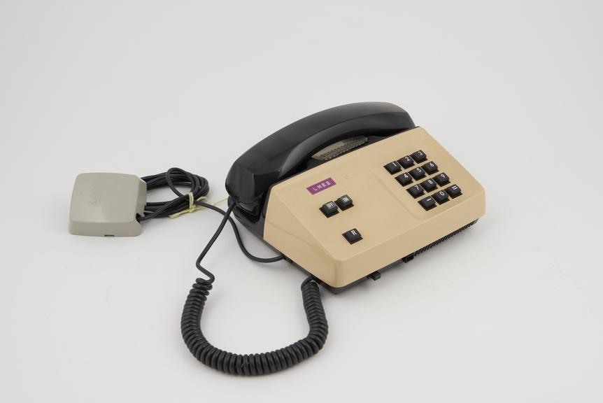 Telephone handset, push button, two-tone black and cream